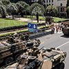 Armoured tanks moving through Brisbane city streets.